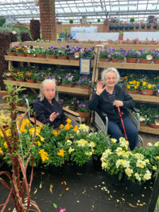 Two of our residents enjoy a day out choosing plants for the garden.