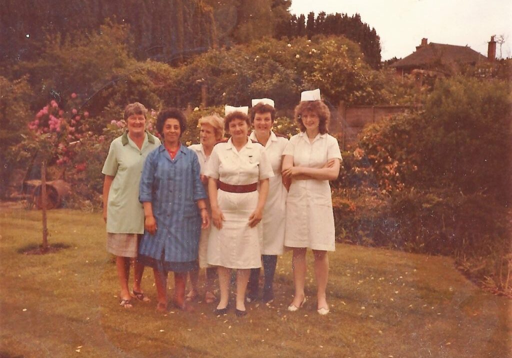 Photos shows members of staff in uniform in house grounds. Early 80s.