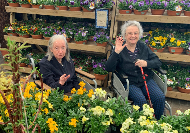Two of our residents enjoy a day out choosing plants for the garden.